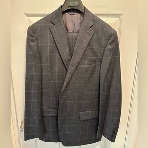 Ralph Lauren Suit. Charcoal grey with light blue stripes. Excellent condition.